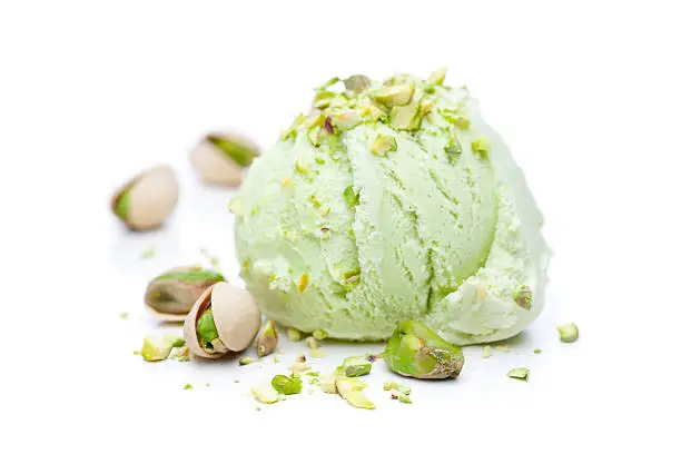Photo of scoop of pistachio ice cream with pistachios