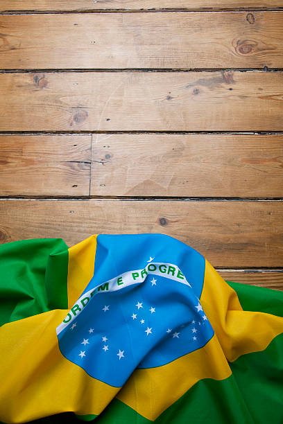 istock Brazilian flag on wooden background 477670679