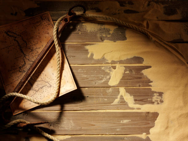 istock Treasure Map and Ships Anchor on Wooden Decking 477671049