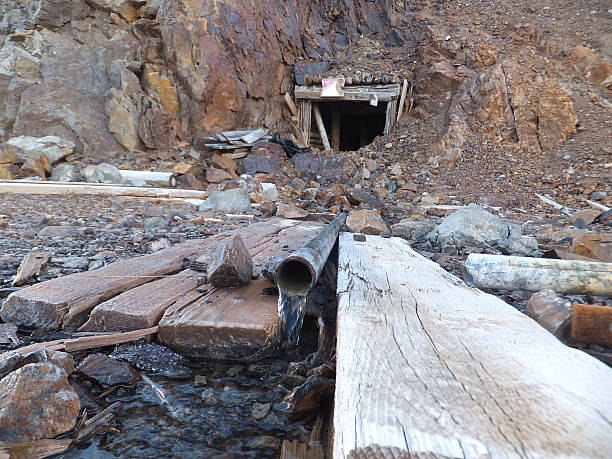 istock Acidic rock drainage from an old mine shaft 477672690