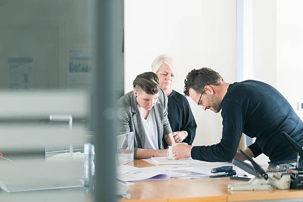 istock Business team analysing model together at desk 477672964