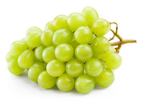 Close-up of grapes with water drops against black background.