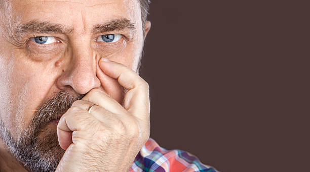 istock thoughtful elderly man with hand near the face 477673744