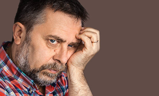 istock thoughtful elderly man with hand near the face 477673764