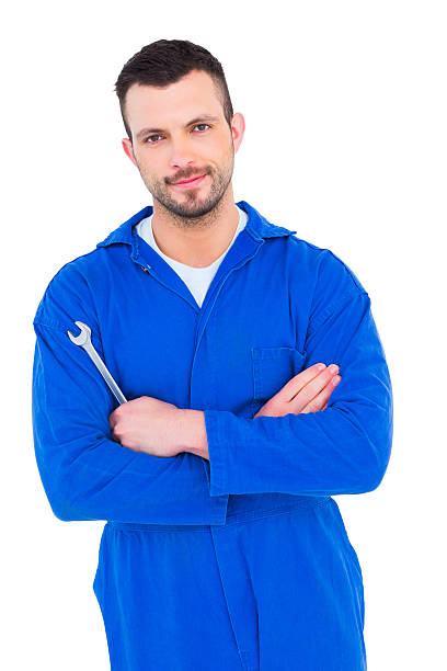 istock Smiling male mechanic holding spanner 477674036