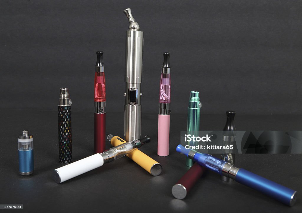 electronic cigarettes electronic cigarettes on a black background Addiction Stock Photo