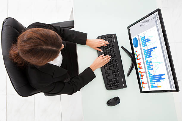 istock Businesswoman Making Financial Charts On Computer At Office Desk 477676238