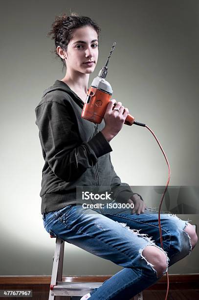 Young Female Holding A Drill Stock Photo - Download Image Now - Adult, Architecture, Beautiful People