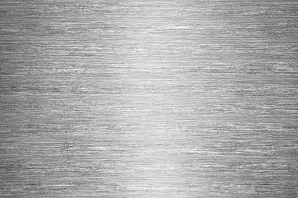 Gray Brushed Metal Texture Background - Steel or Aluminium Real macro shot of a brushed metal surface, with reflected light in the centre of image. brushed metal stock pictures, royalty-free photos & images