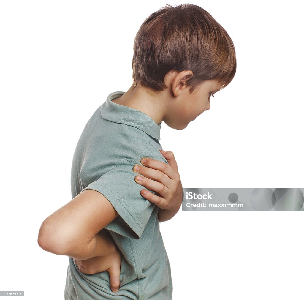 osteochondrosis teenage boy holds his hand behind back osteochondrosis teenage boy holds his hand behind his back back pain isolated on white background Backache Stock Photo