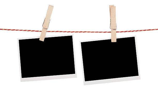 istock Blank photos hanging on clothesline 477682667