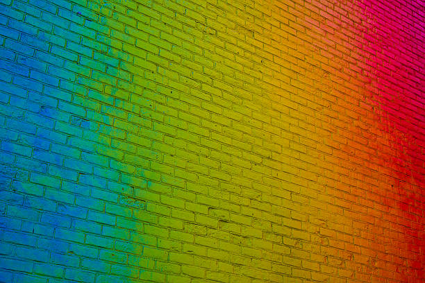 istock Angle shot of a vibrant rainbow colored brick wall 477682863