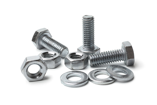 Steel bolts and nuts on white background