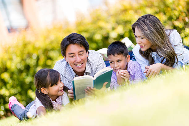 istock Father reading to his family 477683725