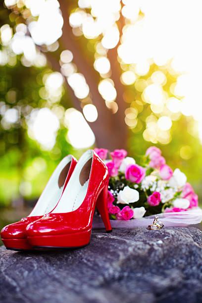 istock Red shoes and flowers 477685449