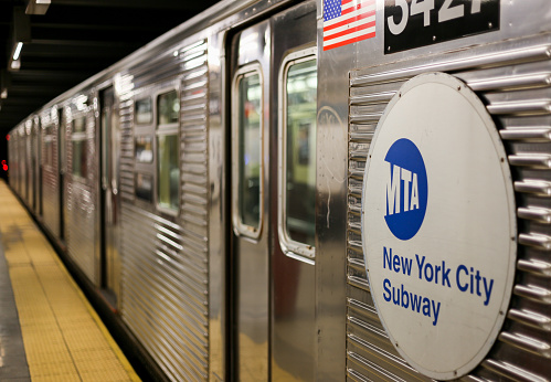 New York City, USA - May 21, 2014: A Subway waits in New York City - the doors are closed.