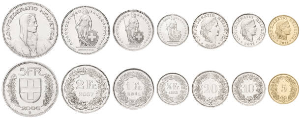 一連のスイス白い背景の上に積み上げられた硬貨 - swiss currency coin swiss francs swiss coin ストックフォトと画像