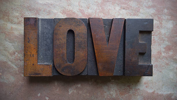 Love - antique wooden letters stock photo