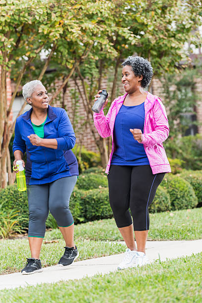 istock Two senior black women pwer walking 477689274