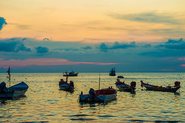 istock Beautiful sunset with boat at Koh Tao 477689426