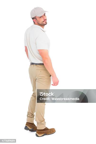 Delivery Man Wearing Cap Stock Photo - Download Image Now - 20-29 Years, 2015, 25-29 Years