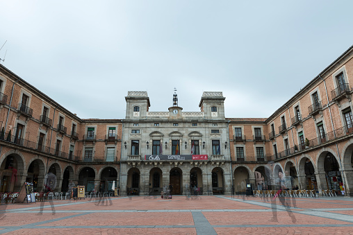 Avila, Spain - May 1, 2015: Multiple exposure of Ávila's City Hall in one of the Main Squares of the city, with defocused local people and tourists moving around.