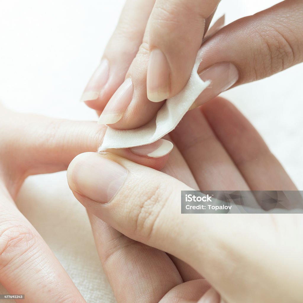Manicure Detail shot of beautiful female hands having manicure treatment Adult Stock Photo