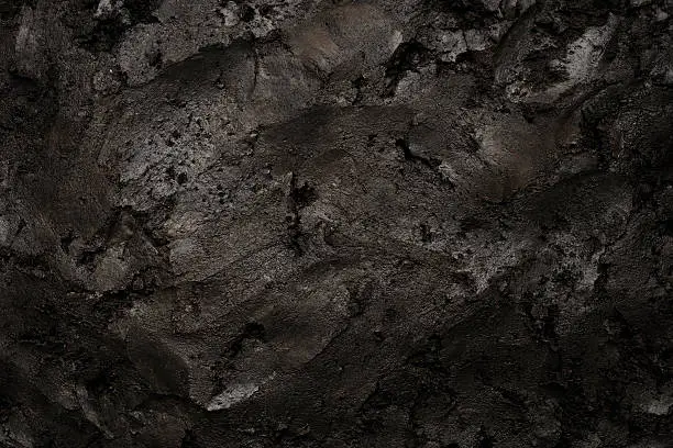 Photo of Close-up of black soil texture background