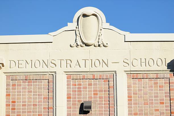 istock Demonstration school sign on building 477693631