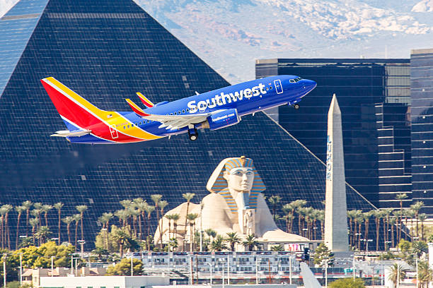 Boeing 737 Southwest Airlines takes off from McCarran International Airport Las Vegas, NV, USA- November 3, 2014: Boeing 737 Southwest Airlines takes off from McCarran International Airport in Las Vegas, NV on November 3, 2014. Southwest is a major US airline and the world's largest low-cost carrier. It is the largest operator of the 737 worldwide.  luxor las vegas stock pictures, royalty-free photos & images