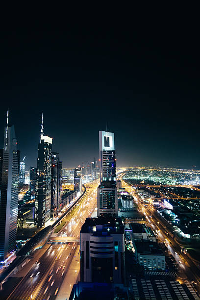 istock Cityscape at night, multiple lane highway, light streaks, skyscrapers,  Dubai 477694514