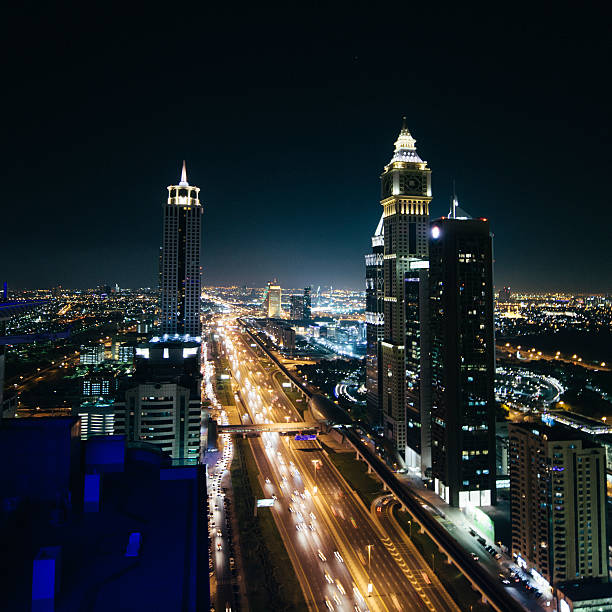 istock Cityscape at night, multiple lane highway, light streaks, skyscrapers,  Dubai 477694524