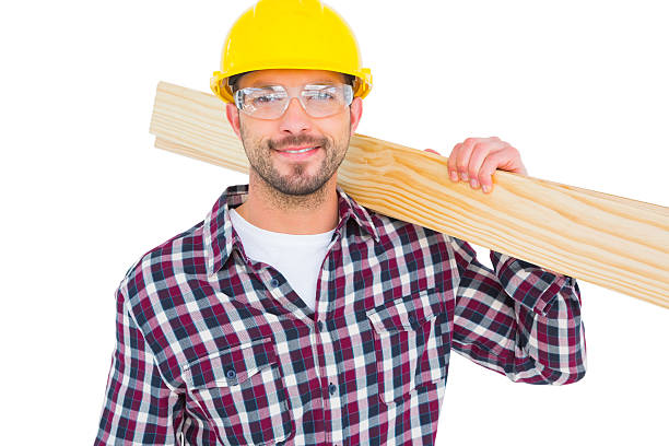 istock Handyman holding wood planks 477694606