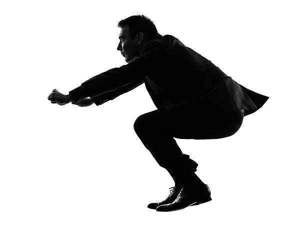 istock business man driving imaginary motorcycle silhouette 477694663