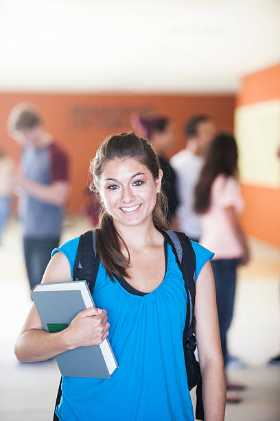 istock Young Female Student with Friends in Background 477694664