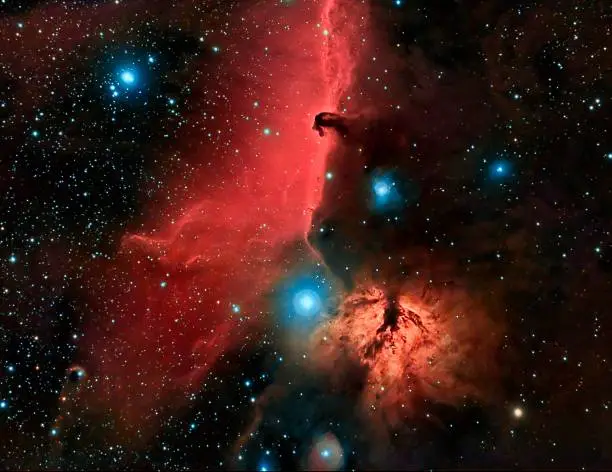 The Horsehead and Flame Nebula in the Orion Constallation.  Image composite of Ha and RGB taken with two telescopes and two CCD cameras.