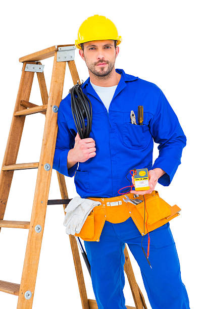 istock Electrician holding cables and multimeter 477696568