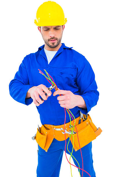 istock Electrician cutting wire with pliers 477696596