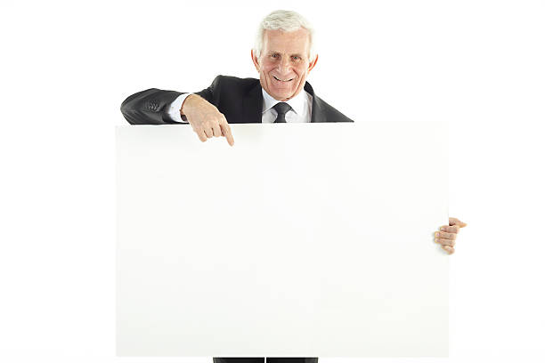istock Businessman holding blank sign 477696619
