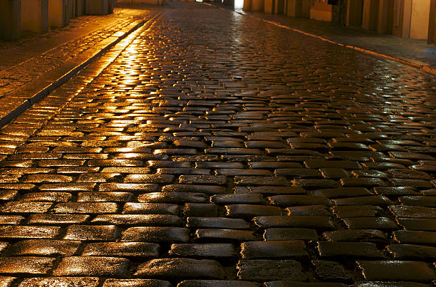 istock cobbled street in the rain 477696733