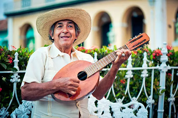 Senior man playing mandolin in Trinidad, Cuba