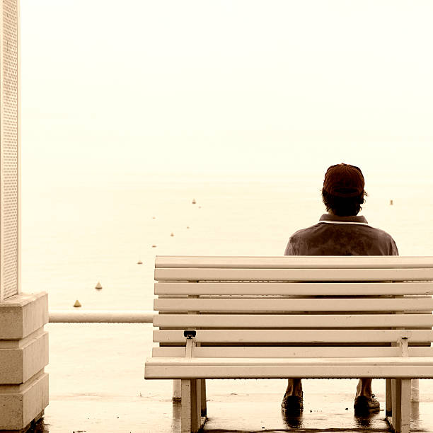 istock Man on a Bench by the Sea.Vintage Style. 477697935