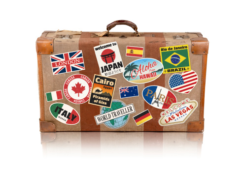 Old travel suitcase with travel stickers. Clipping Path included.