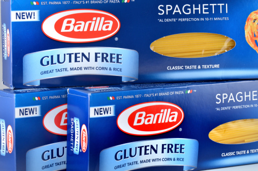 Quakertown, Pennsylvania, United States - March 03, 2014. Boxes of Barilla gluten free spaghetti. EST. PARMA 1877 - ITALY'S #1 BRAND OF PASTA. Photograph taken in a studio light box.