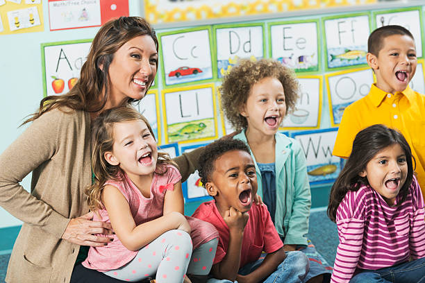 istock Teacher in class with multiracial group of preschoolers 477699834