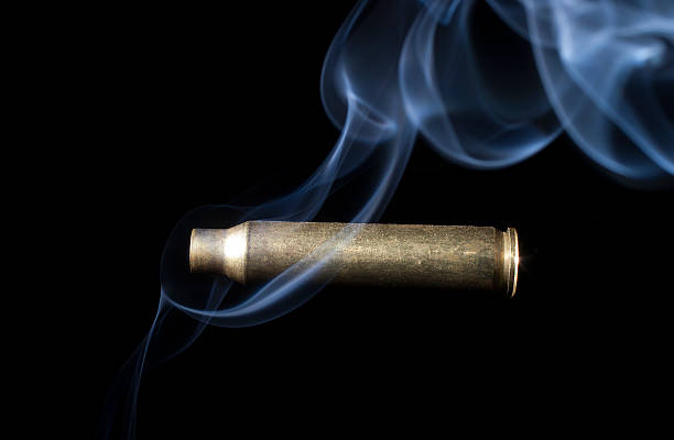 istock Smoking brass from a rifile on black 477700610