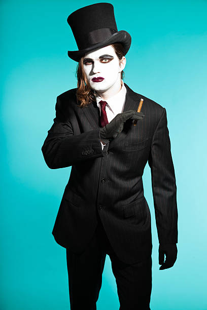 istock Gothic vampire looking business man wearing black striped suit. 477701497