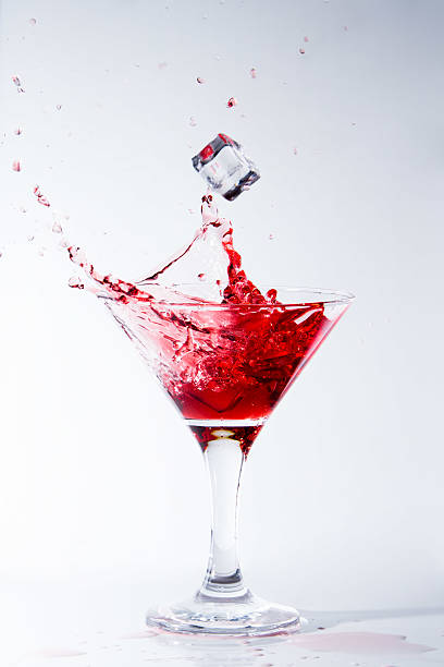 istock Ice falls in a glass with red cocktail 477702706