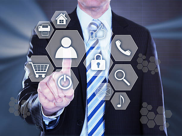 istock Businessman Pressing Virtual Icons 477702932