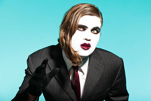 istock Gothic vampire looking business man wearing black striped suit. 477703109
